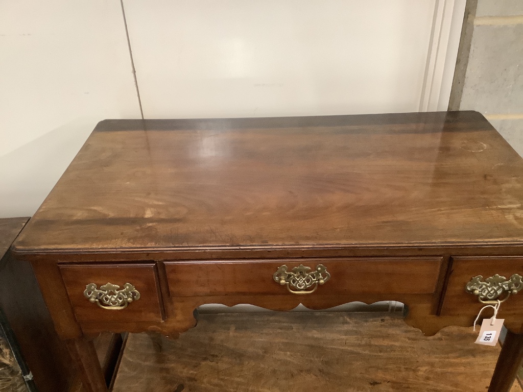 A George III mahogany lowboy fitted three short drawers, width 92cm depth 50cm height 69cm